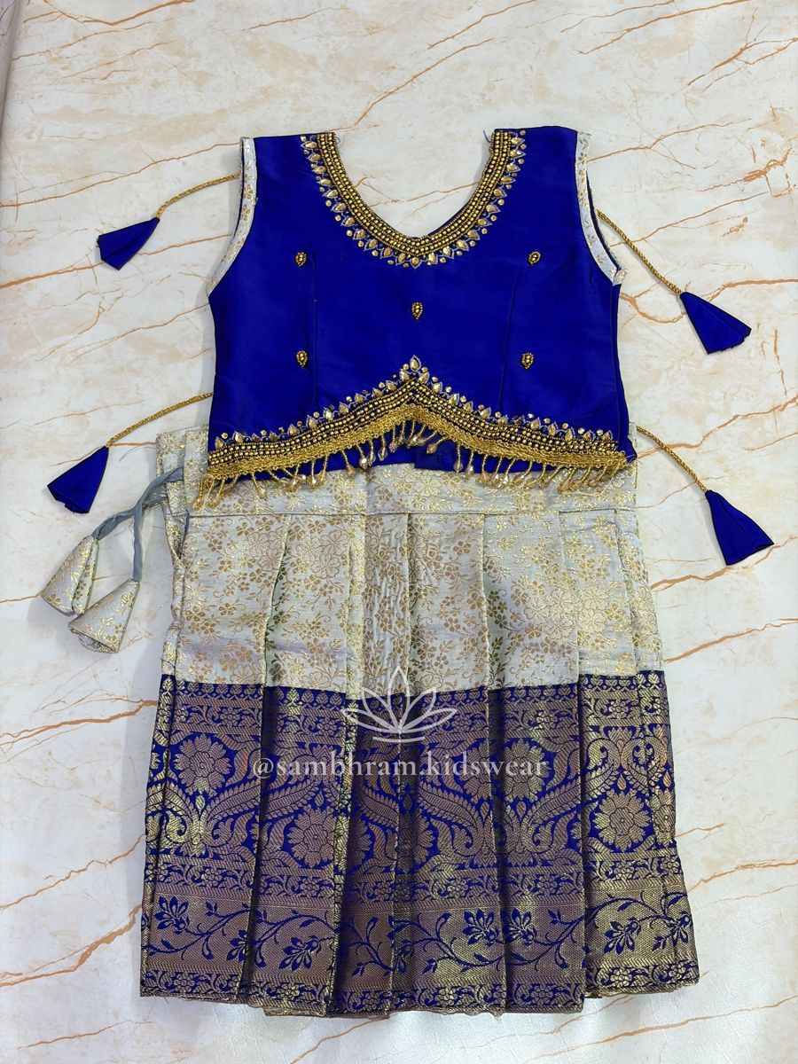 Royal blue blouse with beaded neckline and fringe, cream brocade langa with blue zari border